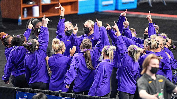 LSU gymnastics huddle together before an event